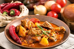 Onion, Spice, beef, bowl, bread, cooked, cuisine, dinner, dish, eating, european, food, goulash, gravy, healthy, herb, homemade, hot, hungarian, hungary, meal, meat, nobody, paprika, parsley, pepper, plate, potato, red, rosemary, sauce, serving, soup, spicy, stew, tomato, traditional, vegetable, wooden