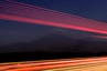 Der Berg Ararat bei Nacht. Vorbeifahrende LKWs auf den Weg in den Iran spiegeln Lichtreflexe.